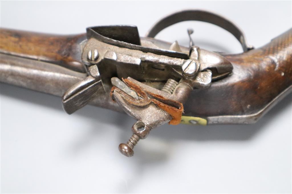 A late 18th century flintlock holster pistol, with walnut stock, 37cm long